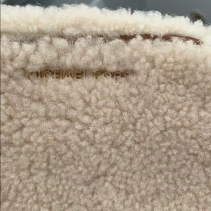 Michael Kors satchel.  fuzzy and off-white color